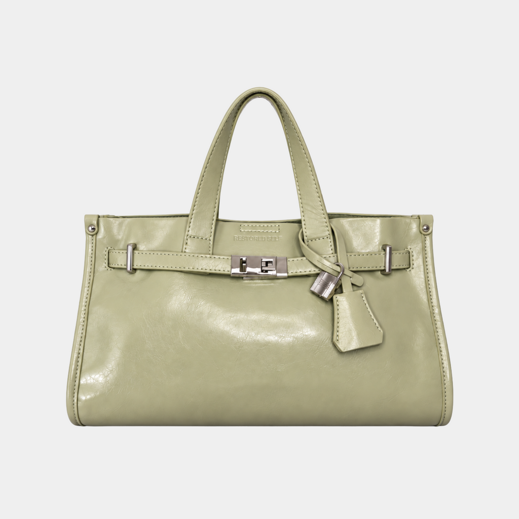 It Girl bag in Butter Pistachio, sage green vegan leather satchel with silver belted lock closure, front view