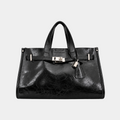 It Girl bag in Ink, black vegan leather satchel with silver belted lock closure, front view